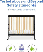 Delta Children Mia Portable Folding Mini Crib with 1.5-Inch Mattress - Greenguard Gold Certified, Ebony Black/Natural