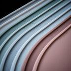 LINE+ARC Oval Silicone Degrē Placemats, Stonewash (20.5"x13", Set of 2) | Modern dining table mats with 3mm raised spill rim, waterproof, heat-safe, stain-resistant, non-slip design, blue